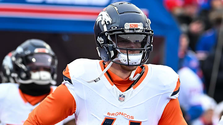 Denver Broncos linebacker Drew Sanders (41) enters the field before an AFC wildcard game against the Buffalo Bills at Highmark Stadium. 