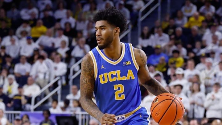 Feb 14, 2026; Ann Arbor, Michigan, USA;  UCLA Bruins guard Donovan Dent (2) dribbles against the Michigan Wolverines at Crisler Center. Mandatory Credit: Rick Osentoski-Imagn Images