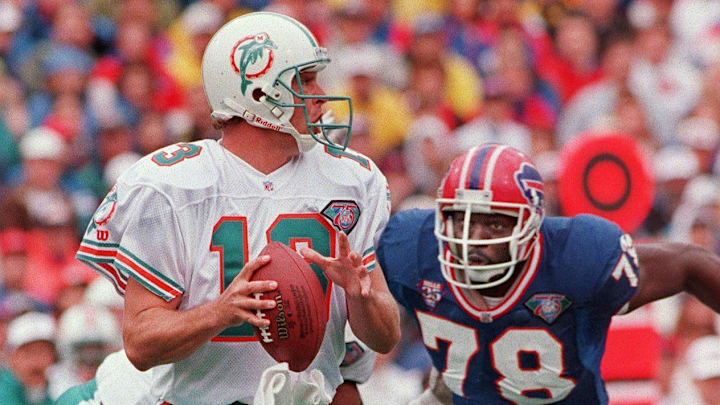 Bills DE Bruce Smith rushes Miami quarterback Dan Marino on Oct. 9, 1994.

Miami Dolphins Dan Marino