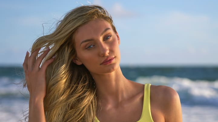 Cameron Brink was photographed by Ben Horton at The Boca Raton. Swimsuit by Andi Bagus. Swimsuit embroidered by Abbode.