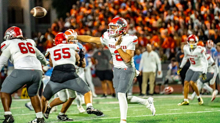 Edgewater quarterback Carter Emanuel (2) completed 13 of 14 passes for 177 yards and one touchdown and rushed four times for 14 yards and a score to help the unbeaten Eagles (10-0) soar past Boone, 28-7, and win the “Battle of the Barrel.” Edgewater will host a playoff game on Nov. 7.
