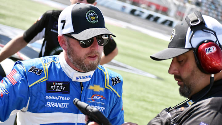 Justin Allgaier (left) debriefs with Jim Pohlman (right) on pit road at Charlotte Motor Speedway in 2024.