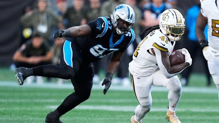 Nov 9, 2025; Charlotte, North Carolina, USA; New Orleans Saints running back Alvin Kamara (41) rushes during the fourth quarter against the Carolina Panthers at Bank of America Stadium. 
