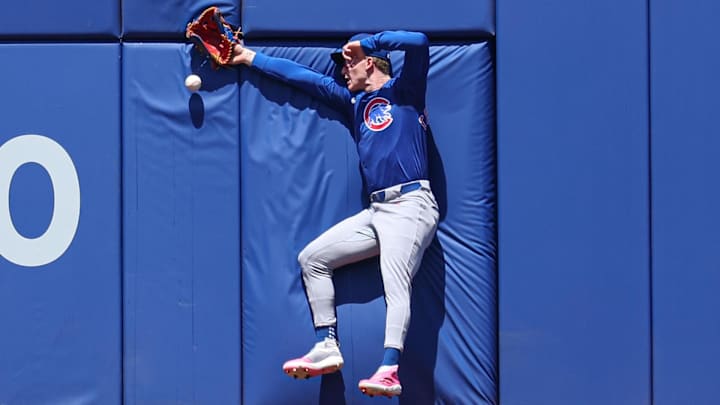 May 11, 2025; New York City, New York, USA; Chicago Cubs center fielder Pete Crow-Armstrong (4) can not catch a ball hit by New York Mets catcher Luis Torrens (not pictured) during the second inning at Citi Field. Mandatory Credit: Vincent Carchietta-Imagn Images