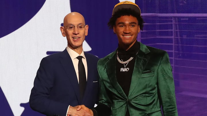 Jalen Hood-Schifino with NBA commissioner Adam Silver after being selected seventeenth by the Los Angeles Lakers in the first round of the 2023 NBA Draft.