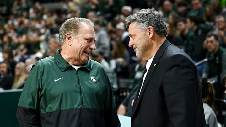 Michigan State's head coach Tom Izzo, left, talks with Oakland's head coach Greg Kampe before the game on Monday, Dec. 18, 2023, at the Breslin Center in East Lansing. \"They get their players going, the level of intensity just ratchets up and there's nothing you can do about it as a visiting player or team,\" Said Kampe of the Izzone impact.