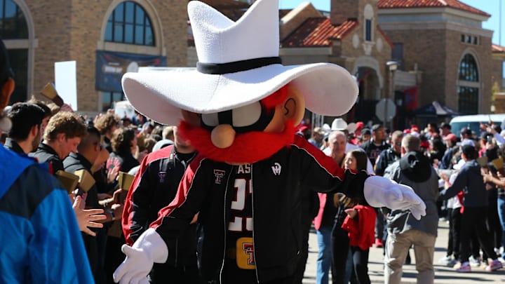Nov 9, 2024; Lubbock, Texas, USA; The Texas Tech Red Raiders mascot greets fans before the the game between the Texas Tech Red Raiders and the Colorado Buffalos at Jones AT&T Stadium and Cody Campbell Field. Mandatory Credit: Michael C. Johnson-Imagn Images