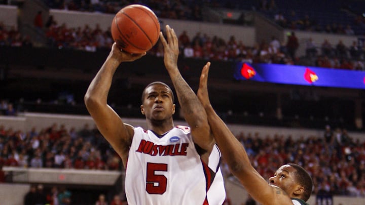 Mar 29, 2009; Indianapolis, IN, USA; Louisville Cardinals guard/forward Earl Clark (5) shoots over Michigan State Spartans forward Delvon Roe (10) during the first half of the finals of the midwest region of the 2009 NCAA mens basketball tournament at Lucas Oil Stadium. Mandatory Credit: Jerry Lai-Imagn Images Mar 29, 2009; Indianapolis, IN, USA; Louisville Cardinals guard/forward Earl Clark (5) shoots over Michigan State Spartans forward Delvon Roe (10) during the first half of the finals of the midwest region of the 2009 NCAA mens basketball tournament at Lucas Oil Stadium. Mandatory Credit: Jerry Lai-Imagn Images