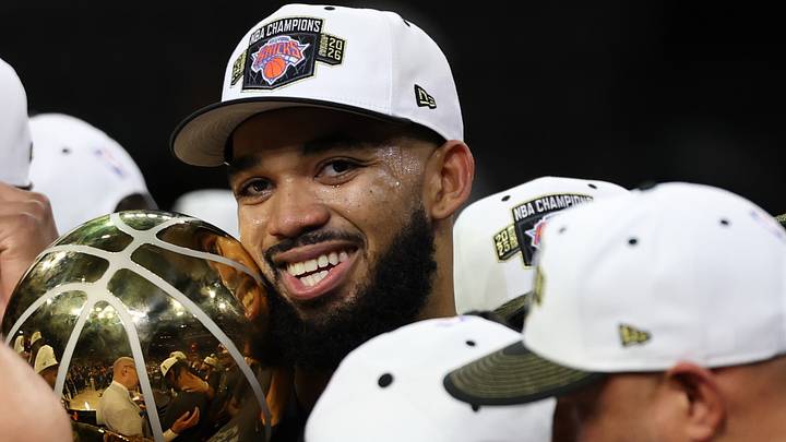 Jun 13, 2026; San Antonio, Texas, USA; New York Knicks center Karl-Anthony Towns holds the Larry O'Brien championship trophy during the championship celebration after game five of the 2026 NBA Finals against the San Antonio Spurs at Frost Bank Center. Mandatory Credit: Geoff Burke-Imagn Images