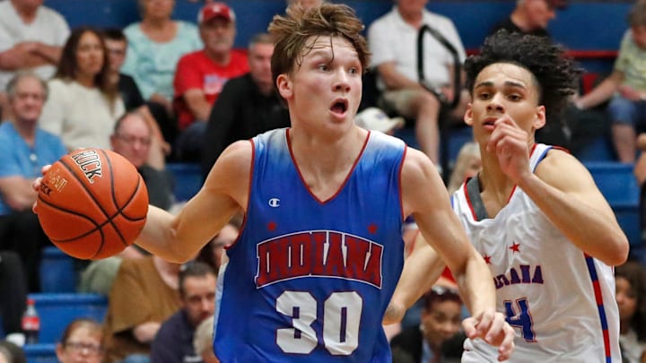 Indiana Junior All-Star Braylon Mullins (30) drives to the basket during the Indiana Boys Junior-Senior All-Star Game. Indiana Junior All-Star Braylon Mullins (30) drives to the basket during the Indiana Boys Junior-Senior All-Star Game.