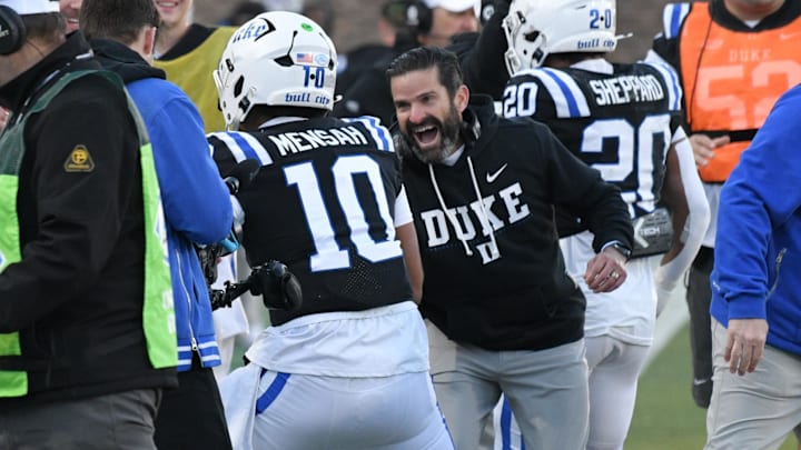  Duke head coach Manny Diaz celebrates with quarterback Darian Mensah (10) against the Wake Forest Demon Deacons