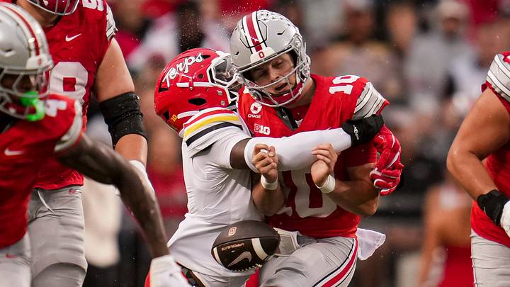 Maryland Terrapins defensive lineman Zion Elee (0) hits Ohio State Buckeyes quarterback Julian Sayin (10) forcing a fumble during the NCAA football game at Ohio Stadium in Columbus on Oct. 10, 2026.