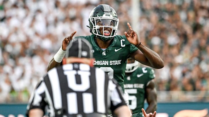 Michigan State's Aidan Chiles communicates with teammates against Florida Atlantic during the first quarter on Friday, Aug. 30, 2024, at Spartan Stadium in East Lansing.