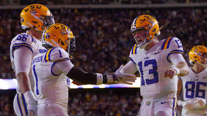 Sep 28, 2024; Baton Rouge, Louisiana, USA;  LSU Tigers wide receiver Aaron Anderson (1) celebrates a touchdown with quarterback Garrett Nussmeier (13) against the South Alabama Jaguars during the first quarter at Tiger Stadium. Mandatory Credit: Stephen Lew-Imagn Images