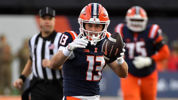 Nov 15, 2025; Champaign, Illinois, USA; Illinois Fighting Illini wide receiver Hudson Clement (13) reacts after a catch and run during the first half against the Maryland Terrapins at Memorial Stadium. Mandatory Credit: Ron Johnson-Imagn Images Nov 15, 2025; Champaign, Illinois, USA; Illinois Fighting Illini wide receiver Hudson Clement (13) reacts after a catch and run during the first half against the Maryland Terrapins at Memorial Stadium. Mandatory Credit: Ron Johnson-Imagn Images