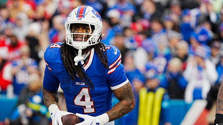 Buffalo Bills running back James Cook (4) smiles after running into the end zone for a touchdown during second half action at the Bills home game against the New York Jets at Highmark Stadium in Orchard Park on Dec. 29, 2024.