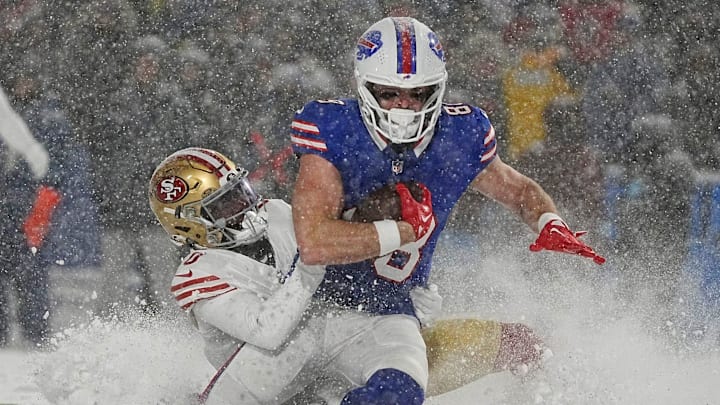 Bills Dawson Knox catches a pass and gets tackled by 49ers Renardo Green during second half action of their home game against the San Francisco 49ers in Orchard Park on Dec. 1, 2024.