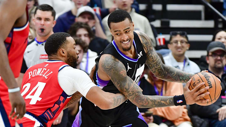 Feb 13, 2025; Salt Lake City, Utah, USA; LA Clippers guard Norman Powell (24) defends Utah Jazz forward/center John Collins (20) during the second half at the Delta Center. Mandatory Credit: Christopher Creveling-Imagn Images