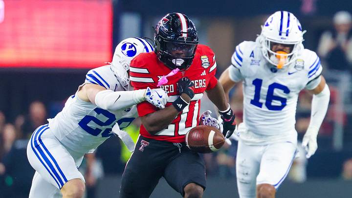 Dec 6, 2025; Arlington, TX, USA; BYU Cougars safety Tanner Wall (28) foces Texas Tech Red Raiders running back J'Koby Williams (20) to fumble during the second quarter at AT&T Stadium. Mandatory Credit: Kevin Jairaj-Imagn Images Dec 6, 2025; Arlington, TX, USA; BYU Cougars safety Tanner Wall (28) foces Texas Tech Red Raiders running back J'Koby Williams (20) to fumble during the second quarter at AT&T Stadium. Mandatory Credit: Kevin Jairaj-Imagn Images