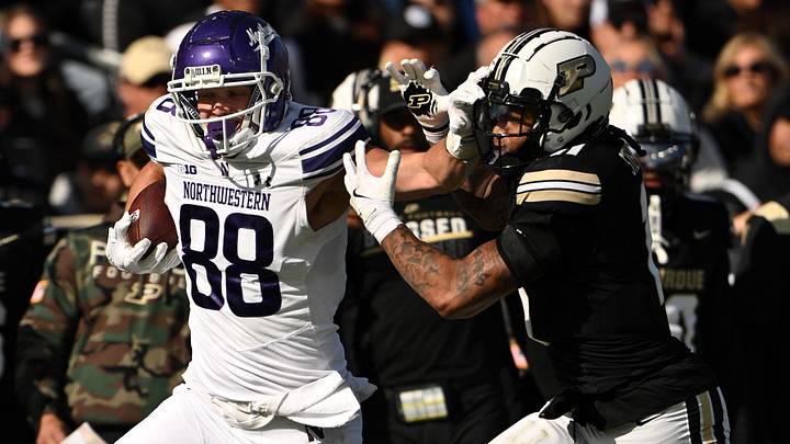 Nov 2, 2024; West Lafayette, Indiana, USA; Northwestern Wildcats tight end Marshall Lang (88) pushes away Purdue Boilermakers defensive back Antonio Stevens (11) during the second quarter at Ross-Ade Stadium. 