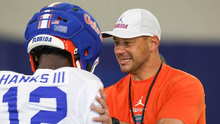 Florida head coach Jon Sumrall talks with Florida cornerback Ben Hanks II (12) during practice during spring practice at Sanders Practice Fields in Gainesville, FL on Thursday, April 2, 2026. [Alan Youngblood/Gainesville Sun]
