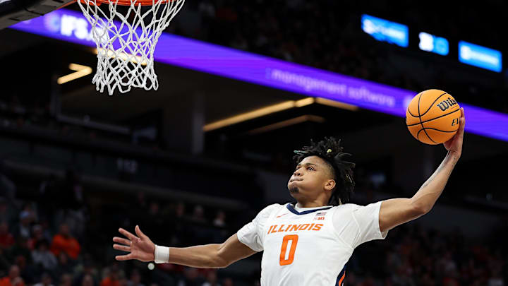 Mar 15, 2024; Minneapolis, MN, USA; Illinois Fighting Illini guard Terrence Shannon Jr. (0) dunks against the Ohio State Buckeyes during the first half at Target Center. Mandatory Credit: Matt Krohn-USA TODAY Sports
