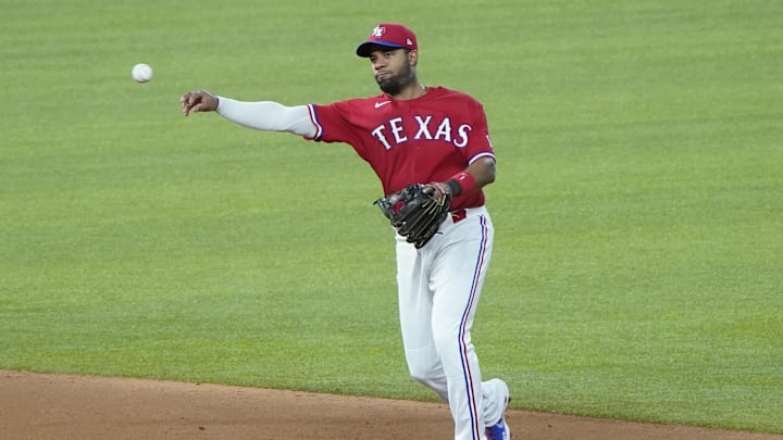 Sep 12, 2020; Arlington, Texas, USA; Texas Rangers shortstop Elvis Andrus (1) throws to first on a ground out by Oakland Athletics third baseman Vimael Machin (39) during the fifth inning of a baseball game at Globe Life Field. 