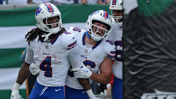 Sep 14, 2025; East Rutherford, New Jersey, USA; Buffalo Bills running back James Cook (4) reacts after rushing the ball for a touchdown against the New York Jets