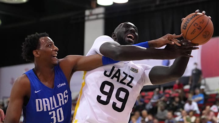 Jul 11, 2022; Las Vegas, NV, USA; Dallas Mavericks forward Marcus Bingham Jr. (30) attempts to steal the ball from Utah Jazz guard Tacko Fall (99) during an NBA Summer League game at Cox Pavilion. Mandatory Credit: Stephen R. Sylvanie-Imagn Images Jul 11, 2022; Las Vegas, NV, USA; Dallas Mavericks forward Marcus Bingham Jr. (30) attempts to steal the ball from Utah Jazz guard Tacko Fall (99) during an NBA Summer League game at Cox Pavilion. Mandatory Credit: Stephen R. Sylvanie-Imagn Images