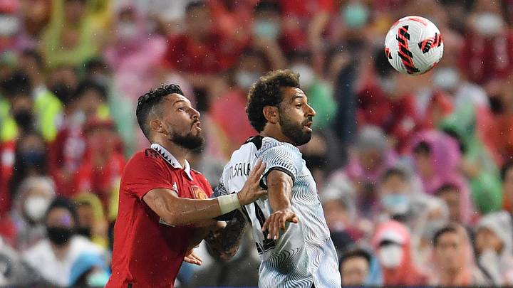 Alex Telles y Mo Salah