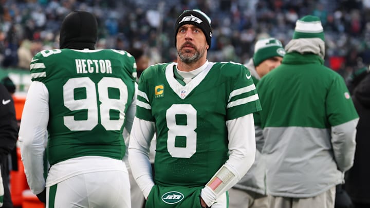Jan 5, 2025; East Rutherford, New Jersey, USA; New York Jets quarterback Aaron Rodgers (8) looks on during the first quarter of their game against the Miami Dolphins at MetLife Stadium. Mandatory Credit: Ed Mulholland-Imagn Images