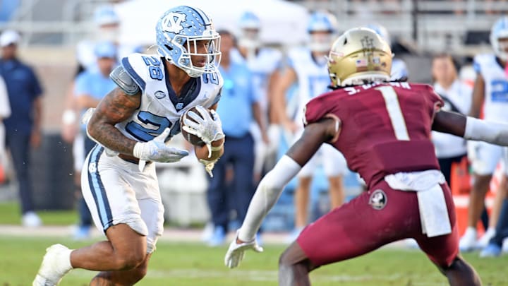 Nov 2, 2024; Tallahassee, Florida, USA;  North Carolina Tarheels running back Omarian Hampton (28) runs the ball against the Florida State Seminoles during the third quarter at Doak S. Campbell Stadium. Mandatory Credit: Robert Myers-Imagn Images