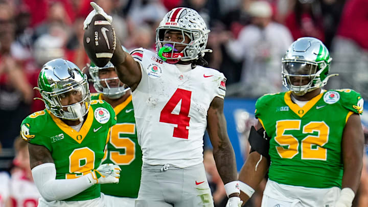 Ohio State Buckeyes wide receiver Jeremiah Smith (4) celebrates a first down catch during the second half of the College Football Playoff quarterfinal against the Oregon Ducks at the Rose Bowl in Pasadena, Calif. on Jan. 1, 2025. Ohio State won 41-21.