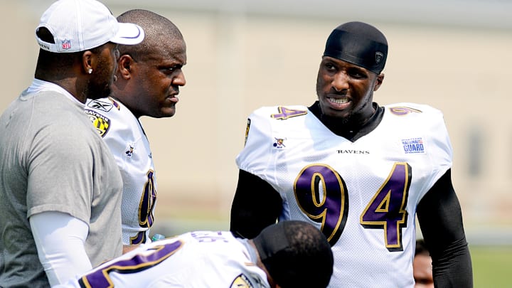 July 29, 2011; Owings Mills, MD, USA; Baltimore Ravens linebacker Sergio Kindle (94) talks to Corey Redding (93) Terrell Suggs (55) and Ray Lewis (52) during training camp at the Baltimore Ravens training facility. Mandatory Credit: Evan Habeeb-Imagn Images July 29, 2011; Owings Mills, MD, USA; Baltimore Ravens linebacker Sergio Kindle (94) talks to Corey Redding (93) Terrell Suggs (55) and Ray Lewis (52) during training camp at the Baltimore Ravens training facility. Mandatory Credit: Evan Habeeb-Imagn Images