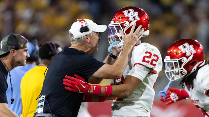 Houston Cougars head coach Willie Fritz celebrates a play with defensive back Marc Stampley II (22) against the Arizona State Sun Devils at Mountain America Stadium.