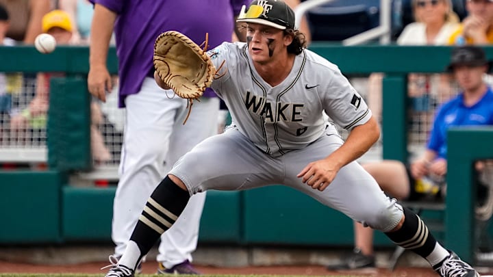 Jun 21, 2023; Omaha, NE, USA; Wake Forest Demon Deacons first baseman Nick Kurtz (8) gets an out during the first inning against the LSU Tigers at Charles Schwab Field Omaha. Mandatory Credit: Dylan Widger-Imagn Images