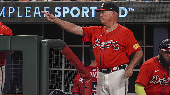Aug 2, 2024; Cumberland, Georgia, USA; Atlanta Braves manager Brian Snitker (43) points from the dugout steps against the Miami Marlins during the eighth inning at Truist Park. Mandatory Credit: Dale Zanine-Imagn Images