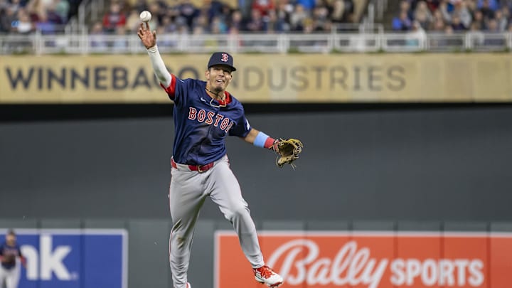 May 3, 2024; Minneapolis, Minnesota, USA; Boston Red Sox second baseman Vaughn Grissom (5) throws the ball to home plate for an out against the Minnesota Twins in the seventh inning at Target Field. Mandatory Credit: Jesse Johnson-Imagn Images