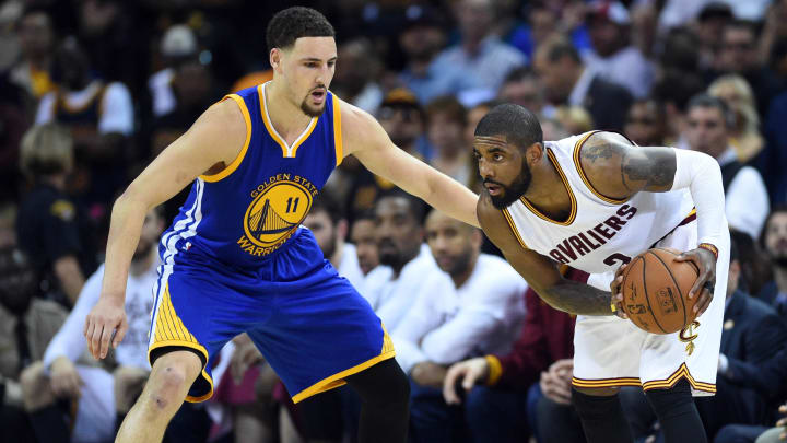 Jun 16, 2016; Cleveland, OH, USA; Cleveland Cavaliers guard Kyrie Irving (2) handles the ball against Golden State Warriors guard Klay Thompson (11) during the second quarter in game six of the NBA Finals at Quicken Loans Arena. Mandatory Credit: Bob Donnan-USA TODAY Sports
