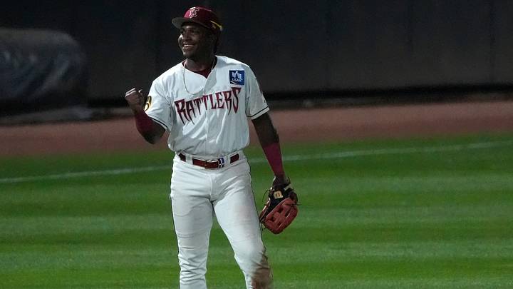 Wisconsin Timber Rattlers Luis Pena (13) reacts after making a difficult throw to first base against the Quad Cities River Bandits during their baseball game Friday, July 17, 2026, at Neuroscience Group Field at Fox Cities Stadium in Grand Chute, Wisconsin. Wisconsin Timber Rattlers Luis Pena (13) reacts after making a difficult throw to first base against the Quad Cities River Bandits during their baseball game Friday, July 17, 2026, at Neuroscience Group Field at Fox Cities Stadium in Grand Chute, Wisconsin.