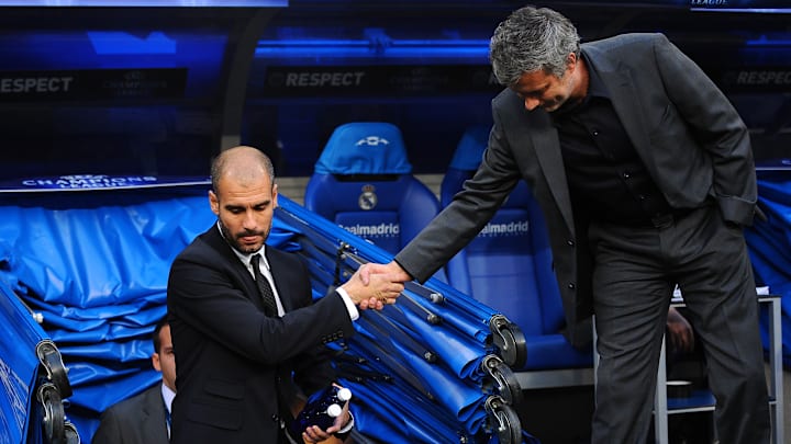 Barcelona's coach Josep Guardiola (L) an