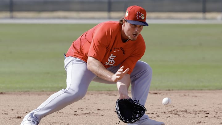 Feb 16, 2026; Jupiter, FL, USA;  St. Louis Cardinals infielder Nolan Gorman (16) fields a ground ball during spring training workouts at Roger Dean Stadium. Mandatory Credit: Reinhold Matay-Imagn Images