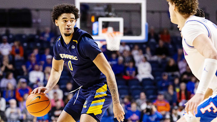 Dec 30, 2023; Gainesville, Florida, USA; Quinnipiac Bobcats forward Alexis Reyes (0) dribbles during