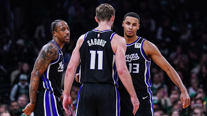 Jan 10, 2025; Boston, Massachusetts, USA; Sacramento Kings forward DeMar DeRozan (10), forward Keegan Murray (13) and forward Domantas Sabonis (11) react after defeating the Boston Celtics at TD Garden. Mandatory Credit: David Butler II-Imagn Images