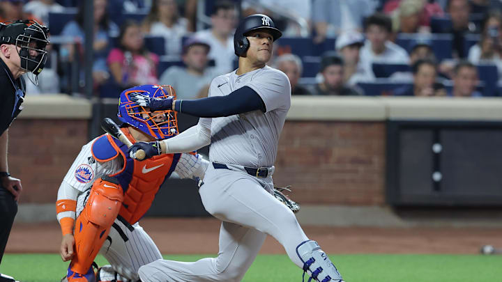 Jun 25, 2024; New York City, New York, USA; New York Yankees right fielder Juan Soto (22) follows through on a solo home run against the New York Mets during the fifth inning at Citi Field.