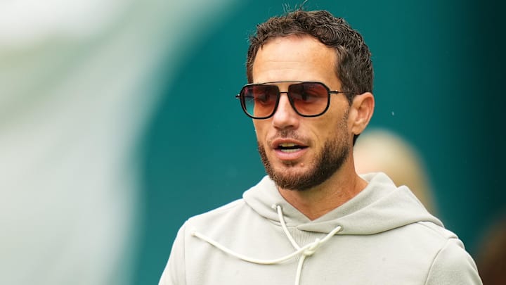 Nov 30, 2025; Miami Gardens, Florida, USA; Miami Dolphins head coach Mike McDaniel stands on the field prior to a game against the New Orleans Saints at Hard Rock Stadium. Mandatory Credit: Rich Storry-Imagn Images
