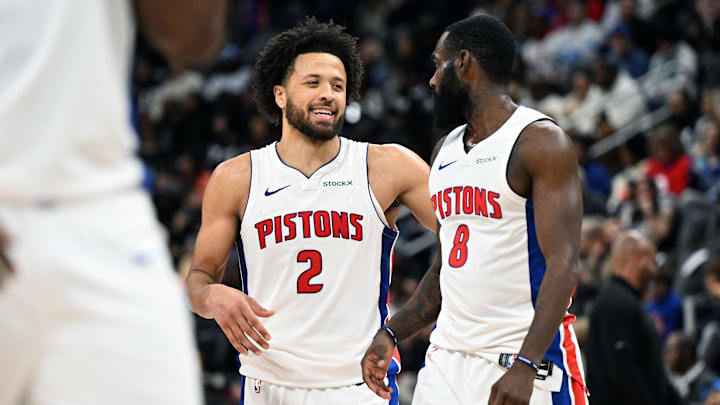 Jan 1, 2025; Detroit, Michigan, USA;  Detroit Pistons guard Cade Cunningham (2) and forward Tim Hardaway Jr. (8) begin to celebrate after Hardaway was fouled late in the fourth quarter against the Orlando Magic to help the Pistons to a victory at Little Caesars Arena. Mandatory Credit: Lon Horwedel-Imagn Images