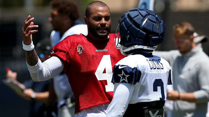 Dallas Cowboys quarterback Dak Prescott talks to wide receiver Brandin Cooks during training camp.