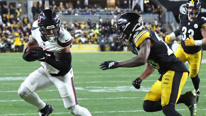 Jan 12, 2026; Pittsburgh, PA, USA; Houston Texans wide receiver Christian Kirk (13) catches a touchdown against Pittsburgh Steelers cornerback Brandin Echols (26) during the first half of an AFC Wild Card Round game at Acrisure Stadium. Mandatory Credit: Charles LeClaire-Imagn Images