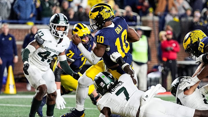 Michigan quarterback Alex Orji (10) runs for a touchdown against Michigan State during the second half at Michigan Stadium in Ann Arbor on Saturday, Oct. 26, 2024.